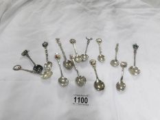 A quantity of souvenir spoons including continental silver