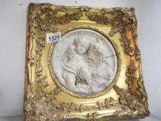 A Renaissance style plaque in gilt frame