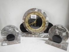 A 3 piece marble clock garniture with key
