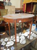 A mahogany veneered inlaid side table in need of restoration