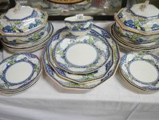 A Royal Doulton Merryweather pattern part dinner set including platters and tureen,