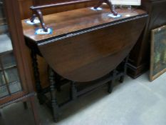 A 19th century oak gate leg table