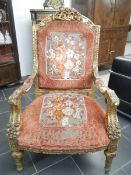 A Victorian gilded arm chair
