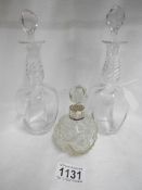 2 19th century glass toilet bottles and a silver rimmed cut glass scent bottle