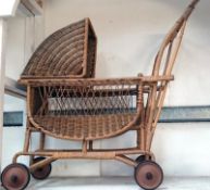 A vintage wicker dolls pram