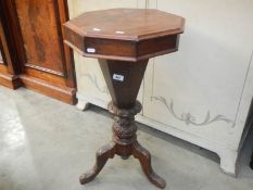 A Victorian sewing table on tripod base