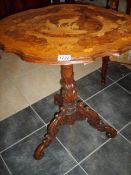 A Victorian inlaid table,