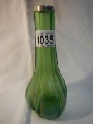 A 'Loetz' green glass vase with silver rim,