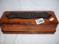 A French kingwood and satinwood glove box with cherub relief panel