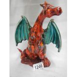 A signed art pottery figure of dragon by Anita Harris