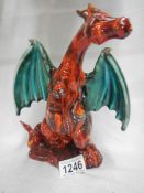 A signed art pottery figure of dragon by Anita Harris