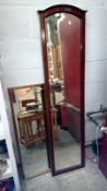 An Edwardian mahogany framed bevel edged mirror and one other