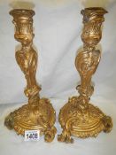 A pair of French gilt ormolu candlesticks