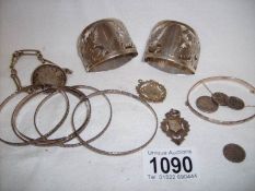 A mixed lot of silver and white metal items including napkin rings,