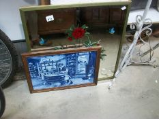 An unusual framed kitchen tile picture and a decorated mirror