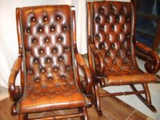 A pair of button back rocking chairs