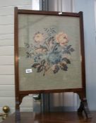 An Edwardian tapestry fire screen in mahogany frame