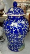 A large blue and white Oriental vase