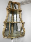A Regency gilded corner wall mirror,