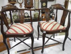 A pair of mahogany inlaid corner chairs