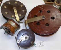 2 large fishing reels and 2 smaller examples