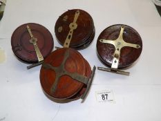 4 vintage wooden reels including 2 star backs