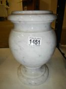 A turned white marble urn