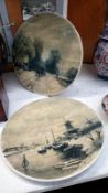 A pair of hand painted plates