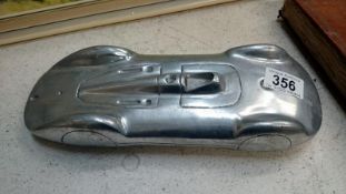 A heavy cast aluminium desk paperweight model of a car