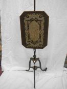 A period pole screen with tapestry inset