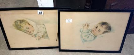 A pair of vintage baby prints