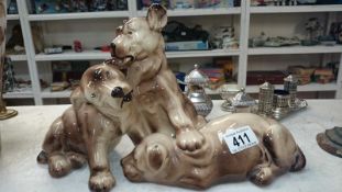 A china figure of 3 puppies playing A/F