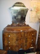 A 19th century walnut serpentine fronted cabinet with 3 drawers and dressing mirror