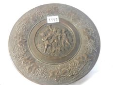 A Victorian bronze plate with cherub decoration, 10.