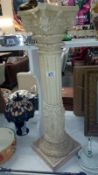 A Corinthian column garden pedestal