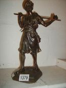 A bronzed spelter figure of a Moorish soldier