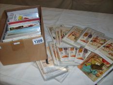 In excess of 200 assorted postcards including humorous, seaside,