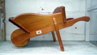 A small wooden wheelbarrow (suit child or planter)