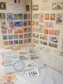 An album of world stamps and a quantity of loose stamps