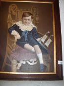 A child portrait print in oak frame,