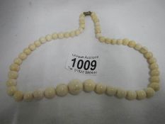An ivory bead necklace
