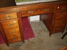 An office desk with leather top,
