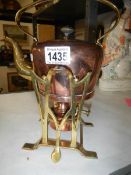 An arts and crafts copper and brass spirit kettle on stand by Gerbruder Bing,
