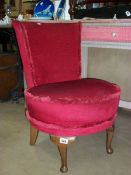 A red dralon and candlewick covered nursing chair on Queen Anne style legs