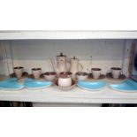A Poole pottery coffee set and 4 dishes