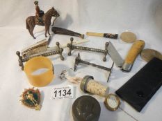 A mixed lot including knife rests, pocket knives,