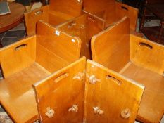 A set of 4 light oak chairs