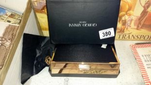 An Armani clutch bag in box