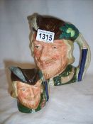 A Royal Doulton Robin Hood character jug and a smaller example