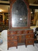 An early 19th century dressing mirror with 8 jewellery drawers and a small cupboard